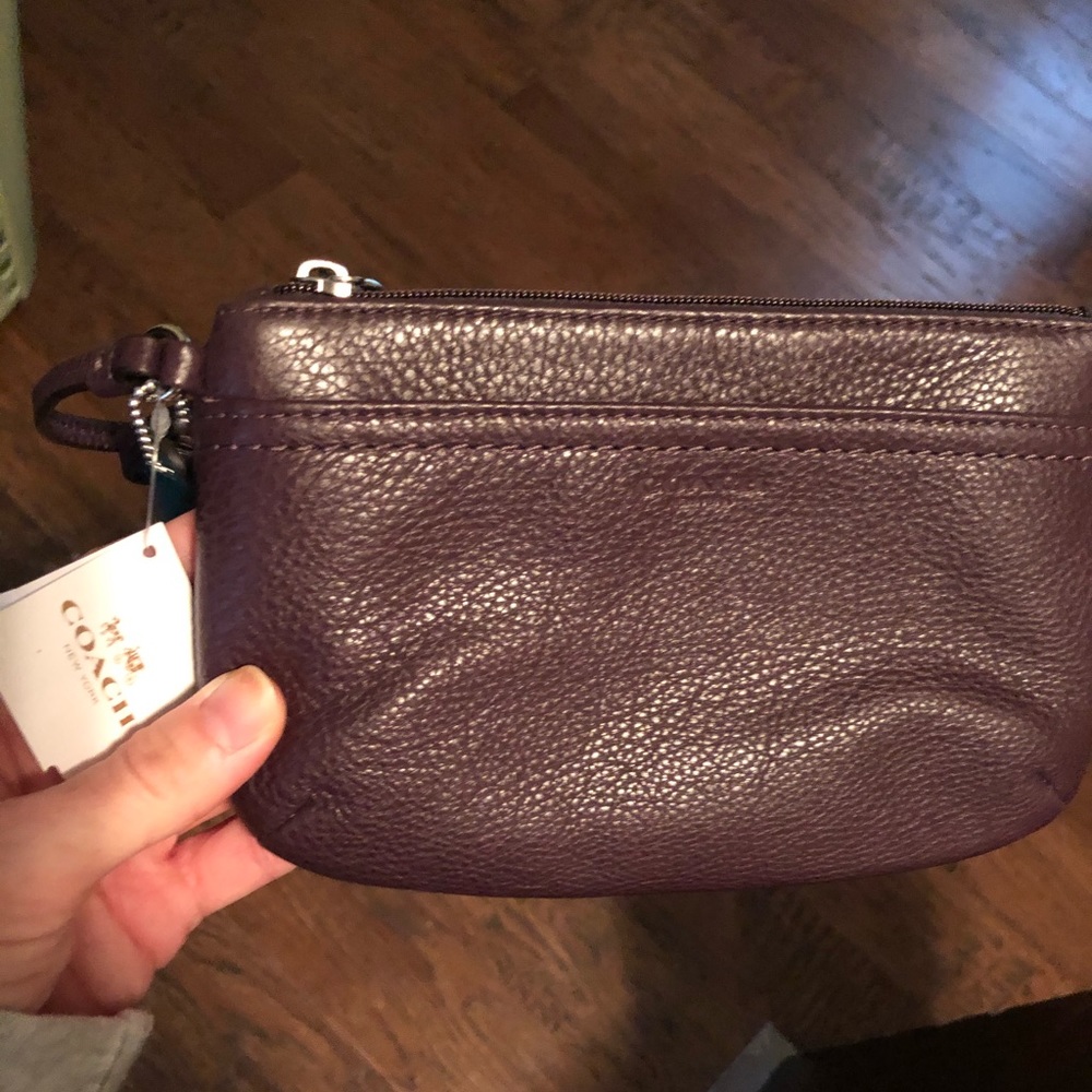 Coach wristlet NWT. Eggplant color